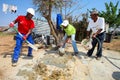 Diverse Community members building a low cost house in Soweto
