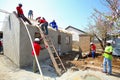 Diverse Community members building a low cost house in Soweto