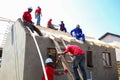 Diverse Community members building a low cost house in Soweto