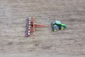 Sowing of corn. Tractor with a seeder on the field