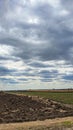 Sowing time in Ukraine during the war. Preparing fields for sowing grain. Blue sky, plowed land. terror.