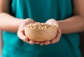 Soy beans in a bowl holding by woman hand Royalty Free Stock Photo