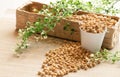 Soy beans in white bowl and brown mesh busket decorated with green leaf