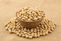 Soy beans in a wooden bowl on sack cloth Royalty Free Stock Photo