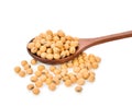 Soy beans in wooden spoon on white