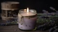 Soy candle with lavender scent on a dark background Royalty Free Stock Photo