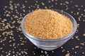 Soy lecithin in a bowl on black background