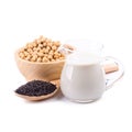 Soy milk in a glass jar and soybeans, black sesame Isolated on w