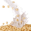 Fresh Soy milk pouring and splash with soy beans background.