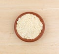 Soy powder in a small bowl on a wood table