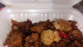 soy sauce chicken in a white lunch box