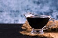 Soy sauce in a glass gravy boat. Copy space. Royalty Free Stock Photo