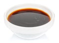 Soy sauce in a small white ceramic round bowl isolated on white background Royalty Free Stock Photo