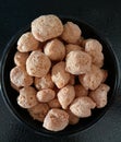 Soya chunk in a bowl and black background