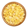 Soya flakes, soy flakes in wooden bowl over white
