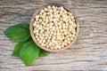 Soya , Soybean in a wooden bowl agricultural products on the wood background / dry soy beans and green leaf Royalty Free Stock Photo