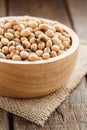 Soybean cereal organic in bowl on wood background vertical view