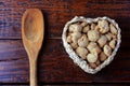 Soybean meat, chunks in a basket with heart shape. Raw soybeans chunks on rustic wooden background