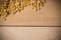 Soybean seed placed a corner on a wooden floor, flay lay with copy space