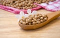 Soybean wooden spoon on a wooden table