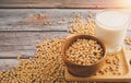 Soybeans in brown wooden bowl with Soy milk