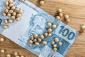 Soybeans spread over one hundred reais of brazilian money, conceptualizing agribusiness and the commodity market