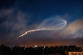 Soyuz space rocket launch. Space jellyfish in sky. Plume of rocket gases in sun at dawn.