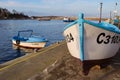Sozopol, Bulgaria - DECEMBER 18, 2022: Fishing boats in the marina at sunset