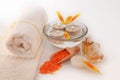 SPA still life with sea salt, towels, flower petals. Royalty Free Stock Photo