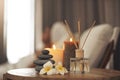 Spa, aromatherapy and candles on table for zen, calm and peace to relax for health and wellness. Stones, flowers and Royalty Free Stock Photo