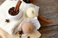 Spa aromatherapy composition with bath bombs, coffee beans, spicies and towel on wooden background.