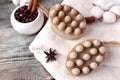 Spa aromatherapy composition with natural soap bars, coffee beans, spicies and towel on wooden background.