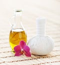 Spa aromatherapy with fragrant oil and a flower Royalty Free Stock Photo