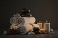 Spa atmosphere, relaxation. Towels, stones and candles. AI generative Royalty Free Stock Photo