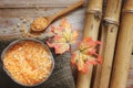 Spa background with bamboo, bath salt in coconut, autumn leaves and towel