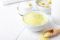 Spa background with bath yellow sea salt, natural cream and chamomile