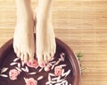 Spa background of beautiful feet and petals Royalty Free Stock Photo