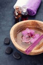 Spa background with orchids, bath oil and stones zen Royalty Free Stock Photo