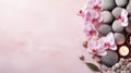 Spa background with orchids and candles on pink background. Royalty Free Stock Photo