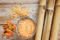 Spa background on a wooden table with bamboo, bath salt, autumn leaf Royalty Free Stock Photo