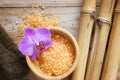 Spa background on a wooden table with bamboo, bath salt and a soft towel Royalty Free Stock Photo