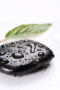 Spa basalt stones and green leaves with water drops Royalty Free Stock Photo