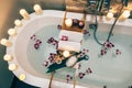 Spa bath with flowers, candles and tray Royalty Free Stock Photo