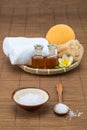 Spa bath, salt bowl spoon, towel sponge essential oil and flower Royalty Free Stock Photo