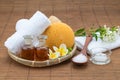 Spa bath, salt spoon, candle towel sponge essential oil and flow Royalty Free Stock Photo