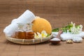 Spa bath, salt spoon, towel sponge essential oil and flower for Royalty Free Stock Photo