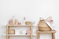 Spa bathroom interior with wooden shelf, stool and skincare products