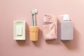 Spa bathroom products. Soap bar, toothbrush, towel, shampoo bottle on pink background Royalty Free Stock Photo