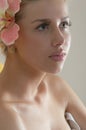 In Spa: Beautiful young sensual woman & flower Royalty Free Stock Photo