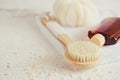 Spa beauty concept. Anti-cellulite massage. Bath Accessories on white stone background, top view, copy space Royalty Free Stock Photo